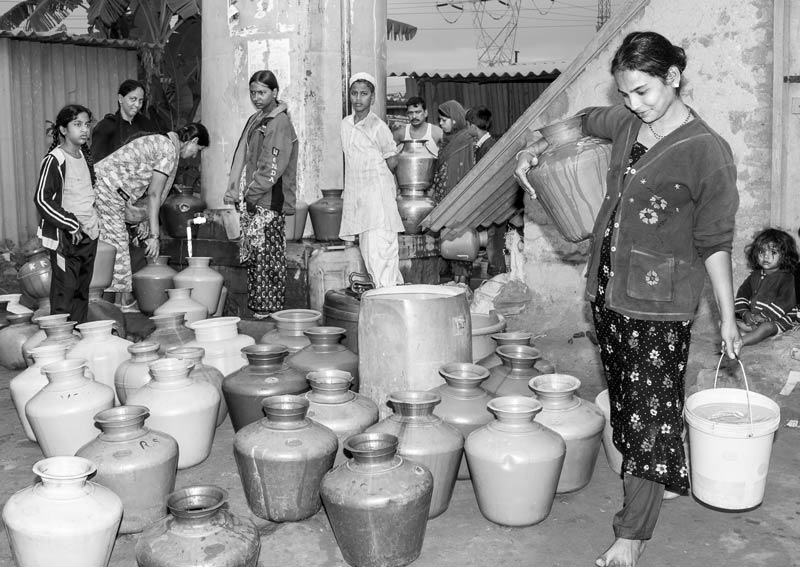 Impediments to enjoyment of Human Right to Water: 'Availability' Norm - Too many seekers for the limited water supplied in a slum in Bengaluru, Karnataka